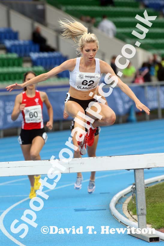 Emily Stewart on her way to winning the 3000 metres steeplechase at the Scottish Championships, Scotstoun  Stadium, Glasgow.